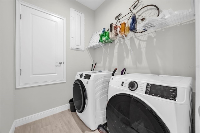 8338 Modiano St, Orlando, FL 32827 - laundry area featuring washing machine and clothes dryer, laundry area, and baseboards