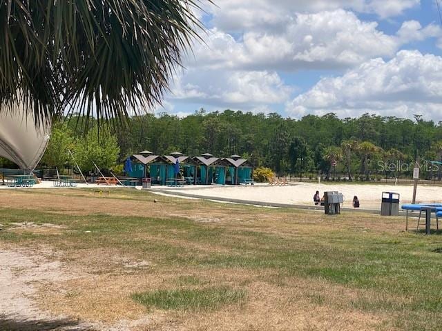 8338 Modiano St, Orlando, FL 32827 - view of playground featuring a lawn