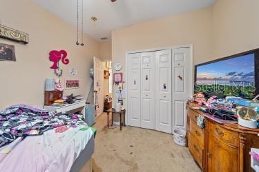 18011 Prairie Wolf Gln, Parrish, FL 34219 - bedroom with ceiling fan, light colored carpet, and a closet