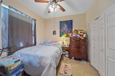 18011 Prairie Wolf Gln, Parrish, FL 34219 - bedroom featuring a ceiling fan, a closet, and carpet flooring