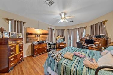 18011 Prairie Wolf Gln, Parrish, FL 34219 - bedroom featuring visible vents and wood finished floors