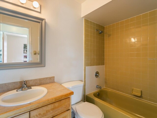12513 Indiana Woods Ln, Orlando, FL 32824 - full bathroom with toilet, vanity, and shower / bathtub combination