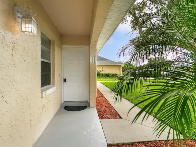 12513 Indiana Woods Ln, Orlando, FL 32824 - doorway to property with stucco siding