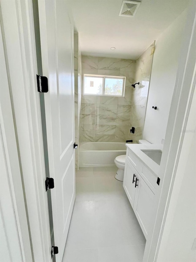 1043 Brenton Ave, Lehigh Acres, FL 33974 - bathroom featuring vanity, bathing tub / shower combination, and toilet