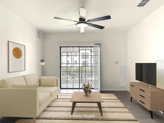 5550 E Michigan St Unit 2214, Orlando, FL 32822 - living room featuring visible vents, baseboards, a ceiling fan, and wood finished floors