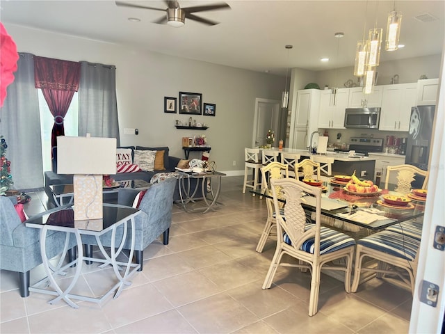 1804 Hudson Ct, Poinciana, FL 34759 - dining room with ceiling fan, recessed lighting, and light tile patterned flooring