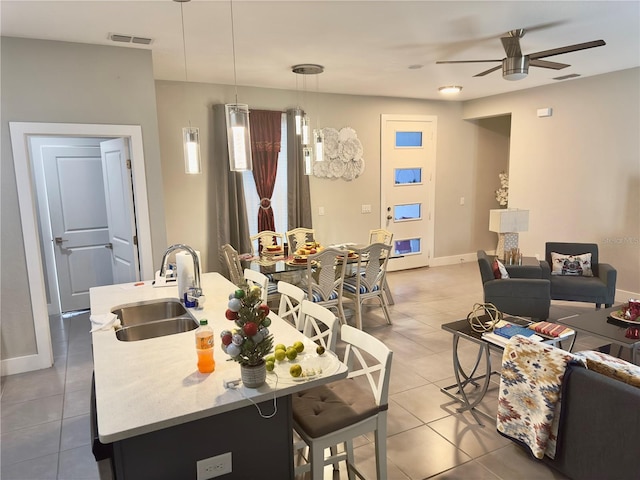 1804 Hudson Ct, Poinciana, FL 34759 - living room with ceiling fan, baseboards, tile patterned flooring, and visible vents