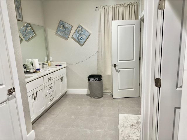 1804 Hudson Ct, Poinciana, FL 34759 - full bathroom featuring vanity, baseboards, and tile patterned flooring