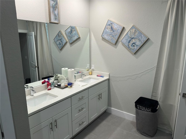 1804 Hudson Ct, Poinciana, FL 34759 - full bath featuring tile patterned flooring, double vanity, baseboards, and a sink