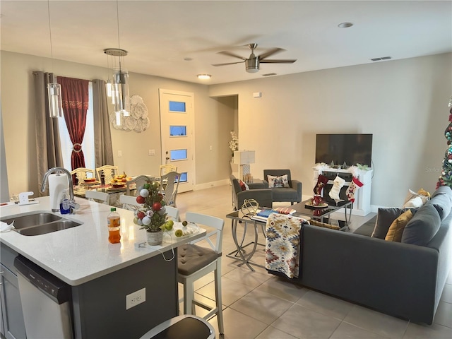 1804 Hudson Ct, Poinciana, FL 34759 - living area featuring light tile patterned floors, baseboards, a ceiling fan, and visible vents
