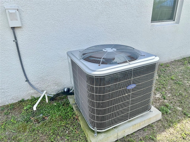 1804 Hudson Ct, Poinciana, FL 34759 - exterior details with stucco siding and central AC unit