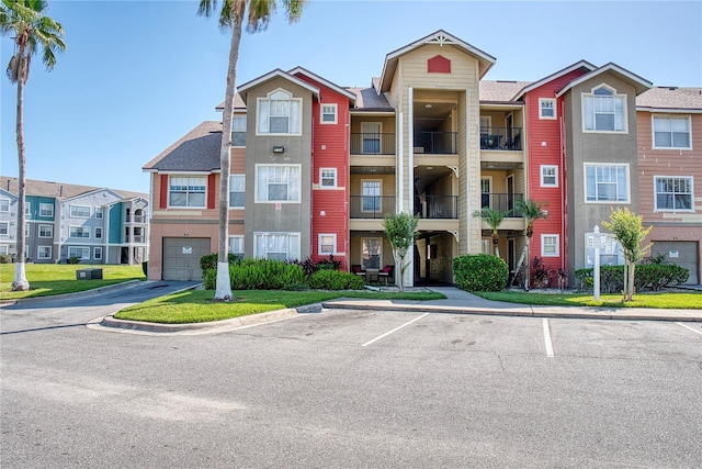 4105 Tropical Isle Blvd Unit 231, Kissimmee, FL 34741 - view of property featuring uncovered parking