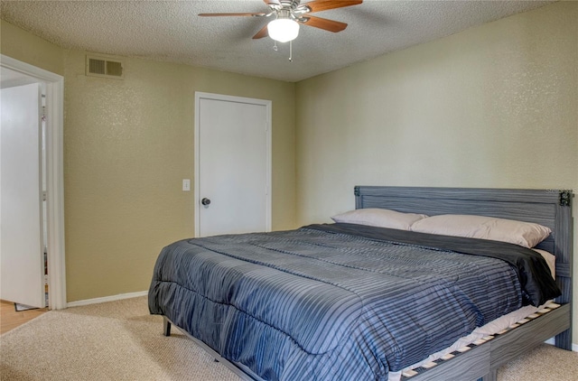 4105 Tropical Isle Blvd Unit 231, Kissimmee, FL 34741 - bedroom featuring a textured ceiling, baseboards, carpet, and visible vents