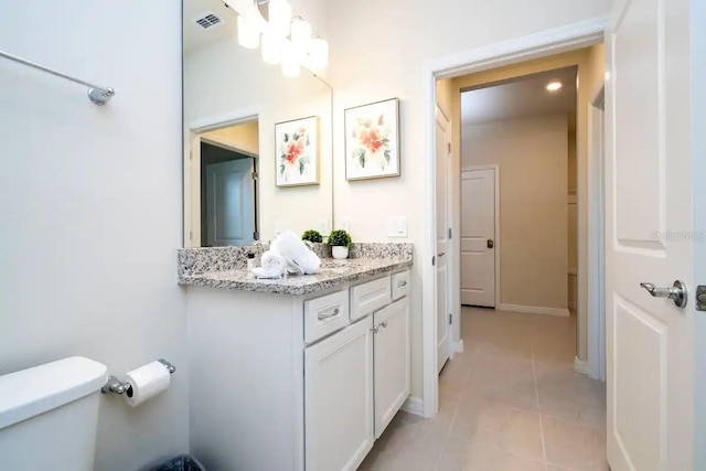 3834 Lana Ave, Davenport, FL 33897 - bathroom featuring vanity, baseboards, tile patterned floors, toilet, and visible vents