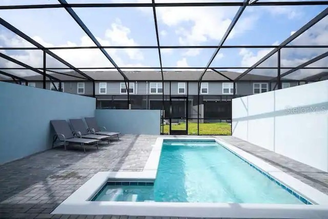 3834 Lana Ave, Davenport, FL 33897 - pool featuring a patio area, a jacuzzi, and a lanai