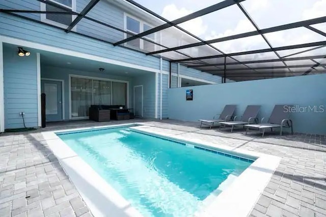 3834 Lana Ave, Davenport, FL 33897 - pool featuring a patio area and glass enclosure