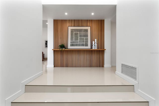 stairway with visible vents and recessed lighting