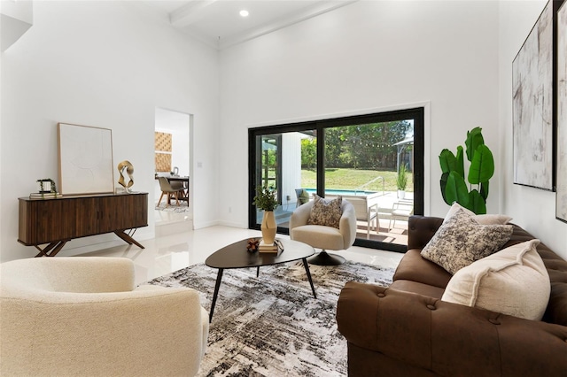 living area featuring recessed lighting, a high ceiling, and beam ceiling