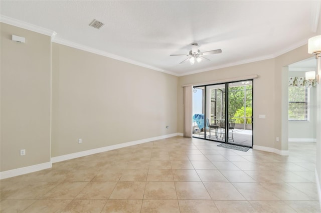 spare room featuring visible vents, ceiling fan, and crown molding