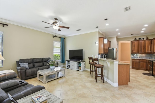 living area with crown molding, visible vents, ceiling fan, light tile patterned flooring, and recessed lighting
