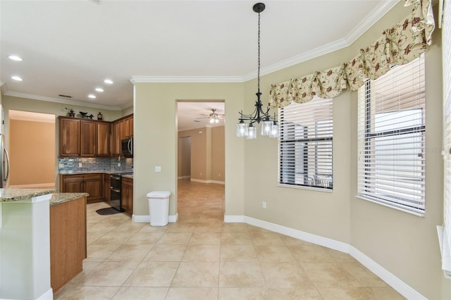 kitchen featuring stainless steel microwave, light tile patterned floors, range with two ovens, light stone counters, and backsplash