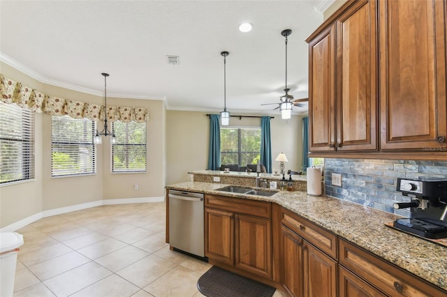 kitchen with tasteful backsplash, a sink, visible vents, dishwasher, and brown cabinetry