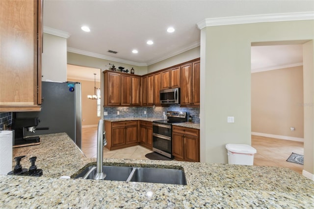 kitchen with a sink, stainless steel appliances, decorative backsplash, light tile patterned flooring, and visible vents