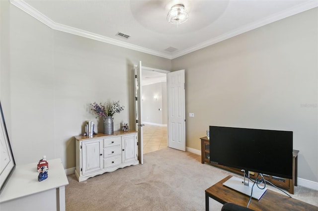 home office featuring light colored carpet, ornamental molding, baseboards, visible vents, and a ceiling fan