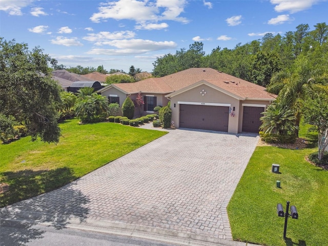 view of front facade featuring decorative driveway, a front lawn, a garage, and stucco siding