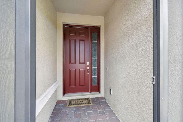 204 Bella Cortina Dr, Kissimmee, FL 34759 - view of exterior entry featuring stucco siding