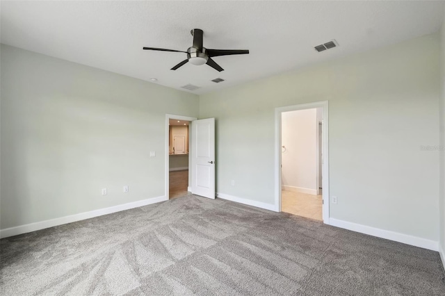 204 Bella Cortina Dr, Kissimmee, FL 34759 - unfurnished bedroom with carpet flooring, baseboards, ceiling fan, and connected bathroom