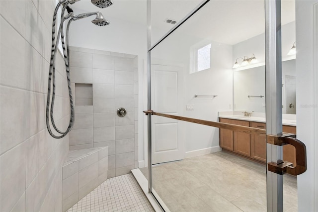 204 Bella Cortina Dr, Kissimmee, FL 34759 - bathroom with a tile shower, tile patterned floors, and vanity