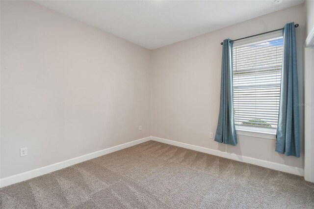 204 Bella Cortina Dr, Kissimmee, FL 34759 - carpeted empty room featuring baseboards