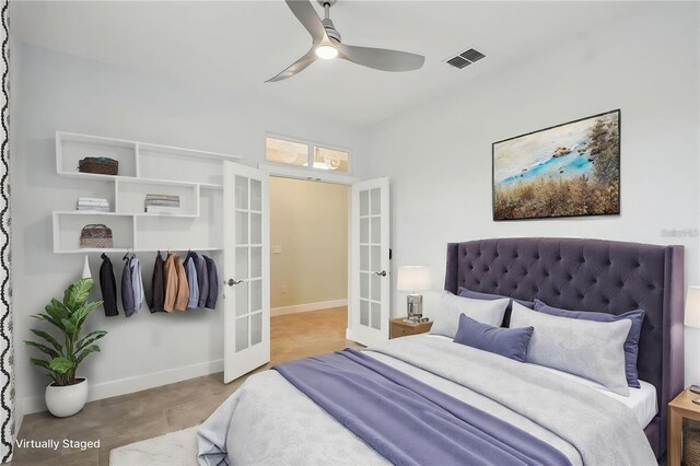 204 Bella Cortina Dr, Kissimmee, FL 34759 - bedroom featuring french doors, baseboards, ceiling fan, and concrete floors