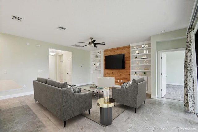 204 Bella Cortina Dr, Kissimmee, FL 34759 - living area featuring a ceiling fan, built in features, and baseboards