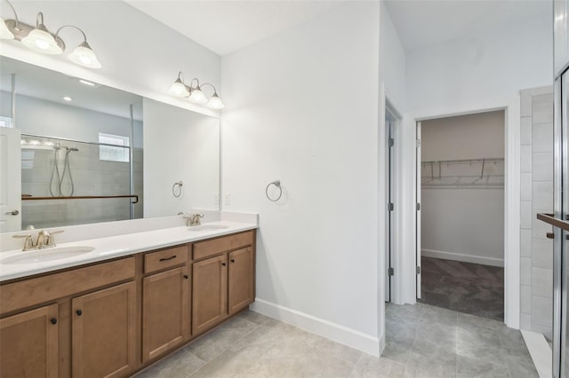 204 Bella Cortina Dr, Kissimmee, FL 34759 - full bath with tiled shower, a walk in closet, double vanity, and tile patterned floors