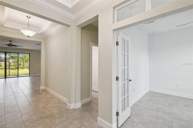 204 Bella Cortina Dr, Kissimmee, FL 34759 - corridor featuring crown molding, baseboards, light tile patterned floors, and a raised ceiling