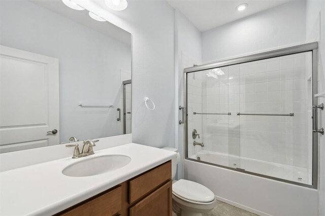 204 Bella Cortina Dr, Kissimmee, FL 34759 - full bathroom with toilet, combined bath / shower with glass door, and vanity
