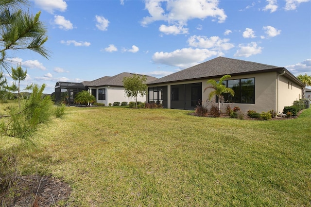 204 Bella Cortina Dr, Kissimmee, FL 34759 - rear view of property featuring stucco siding and a yard