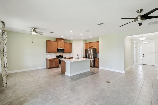 204 Bella Cortina Dr, Kissimmee, FL 34759 - kitchen with a ceiling fan, appliances with stainless steel finishes, a sink, open floor plan, and recessed lighting
