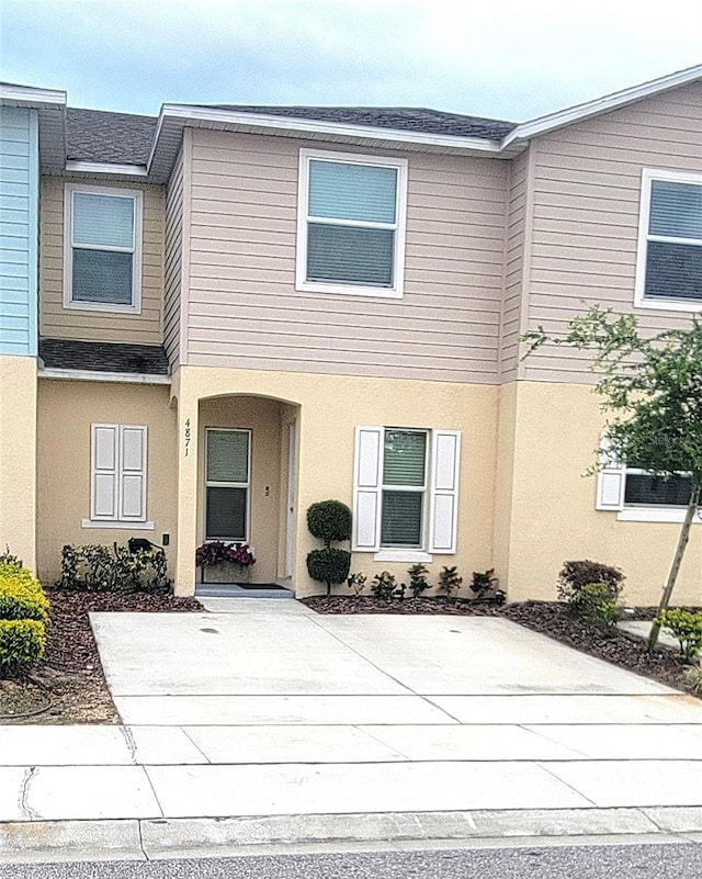 4871 Coral Castle Dr, Kissimmee, FL 34746 - view of property with stucco siding