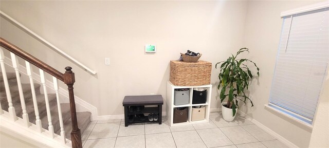 4871 Coral Castle Dr, Kissimmee, FL 34746 - interior space featuring light tile patterned floors, baseboards, and stairway