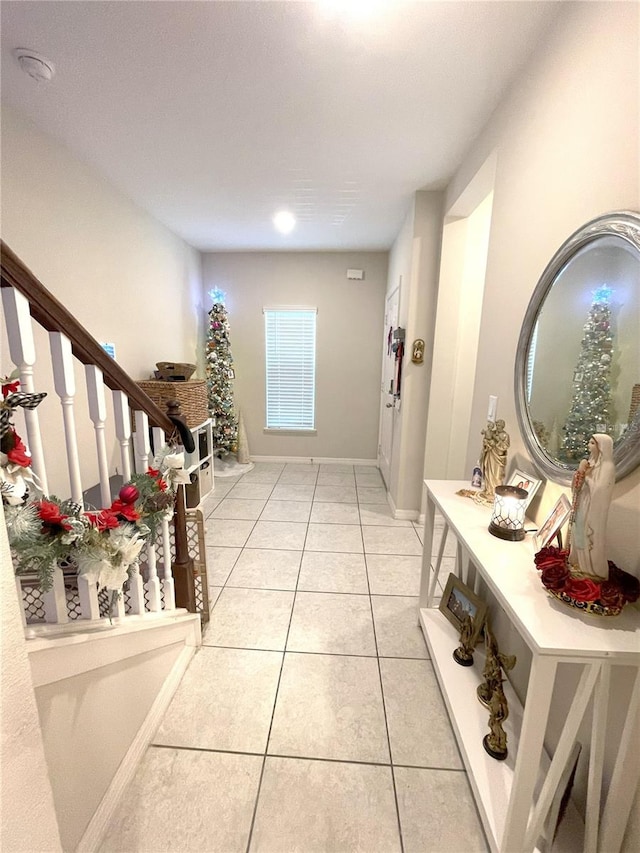 4871 Coral Castle Dr, Kissimmee, FL 34746 - corridor with stairway, baseboards, and light tile patterned floors
