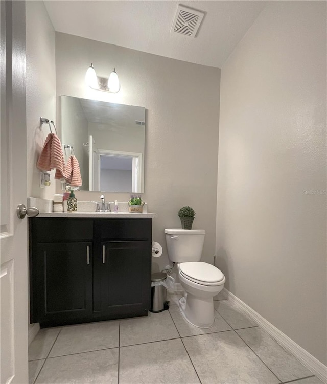 4871 Coral Castle Dr, Kissimmee, FL 34746 - bathroom featuring tile patterned floors, vanity, baseboards, toilet, and visible vents