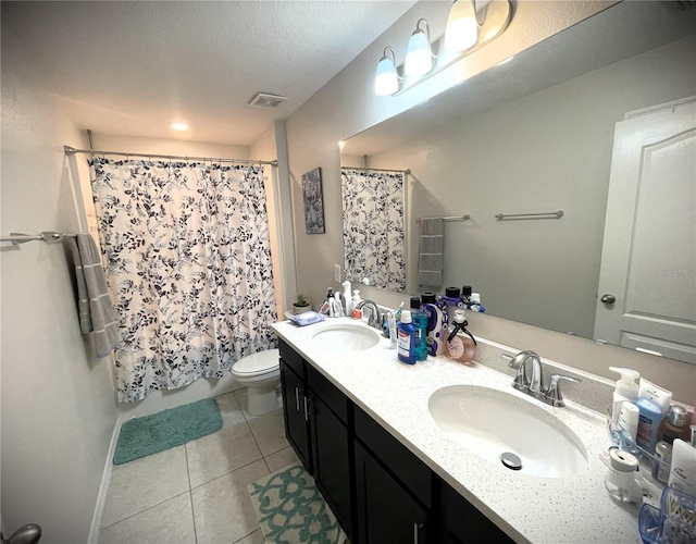 4871 Coral Castle Dr, Kissimmee, FL 34746 - full bath with tile patterned floors, a sink, double vanity, and toilet