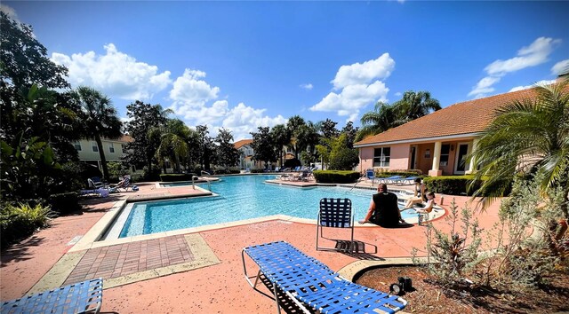 4871 Coral Castle Dr, Kissimmee, FL 34746 - community pool with a patio area
