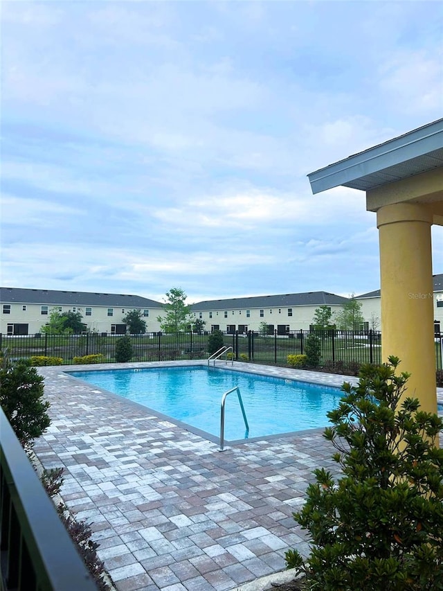 4871 Coral Castle Dr, Kissimmee, FL 34746 - view of pool with a fenced in pool, a patio, and fence