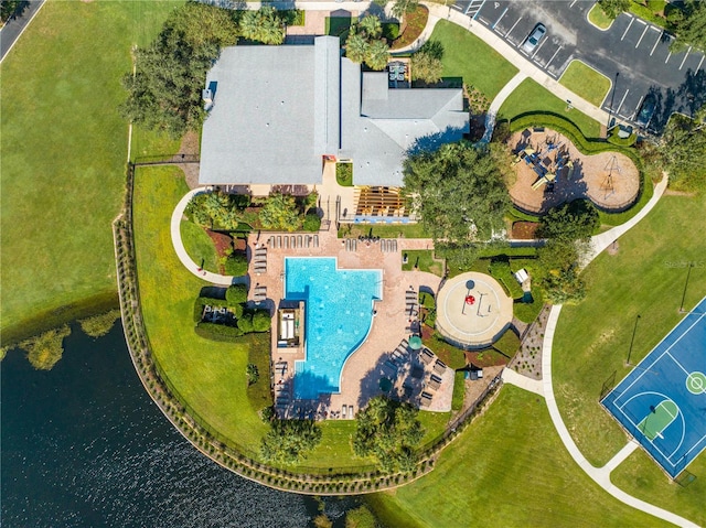 birds eye view of property with a water view