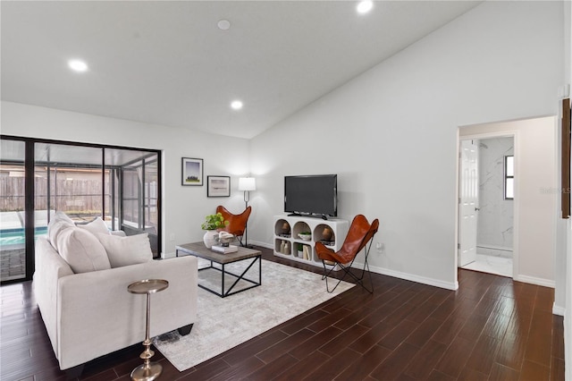living room with baseboards, recessed lighting, high vaulted ceiling, and wood finished floors