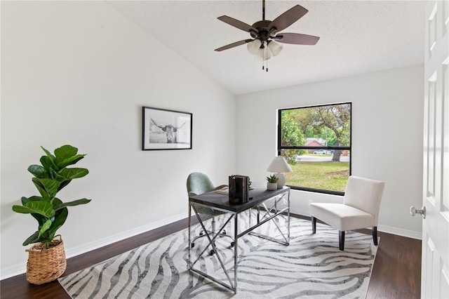 home office with a textured ceiling, a ceiling fan, wood finished floors, lofted ceiling, and baseboards